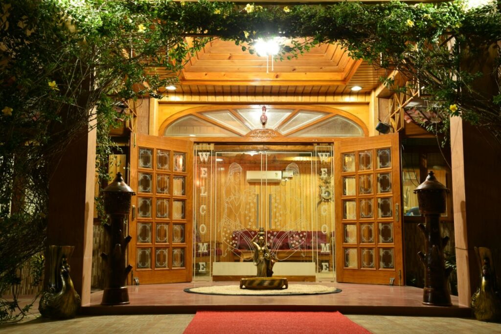 Reception entrance at Lush Green Retreat framed by greenery and timber details